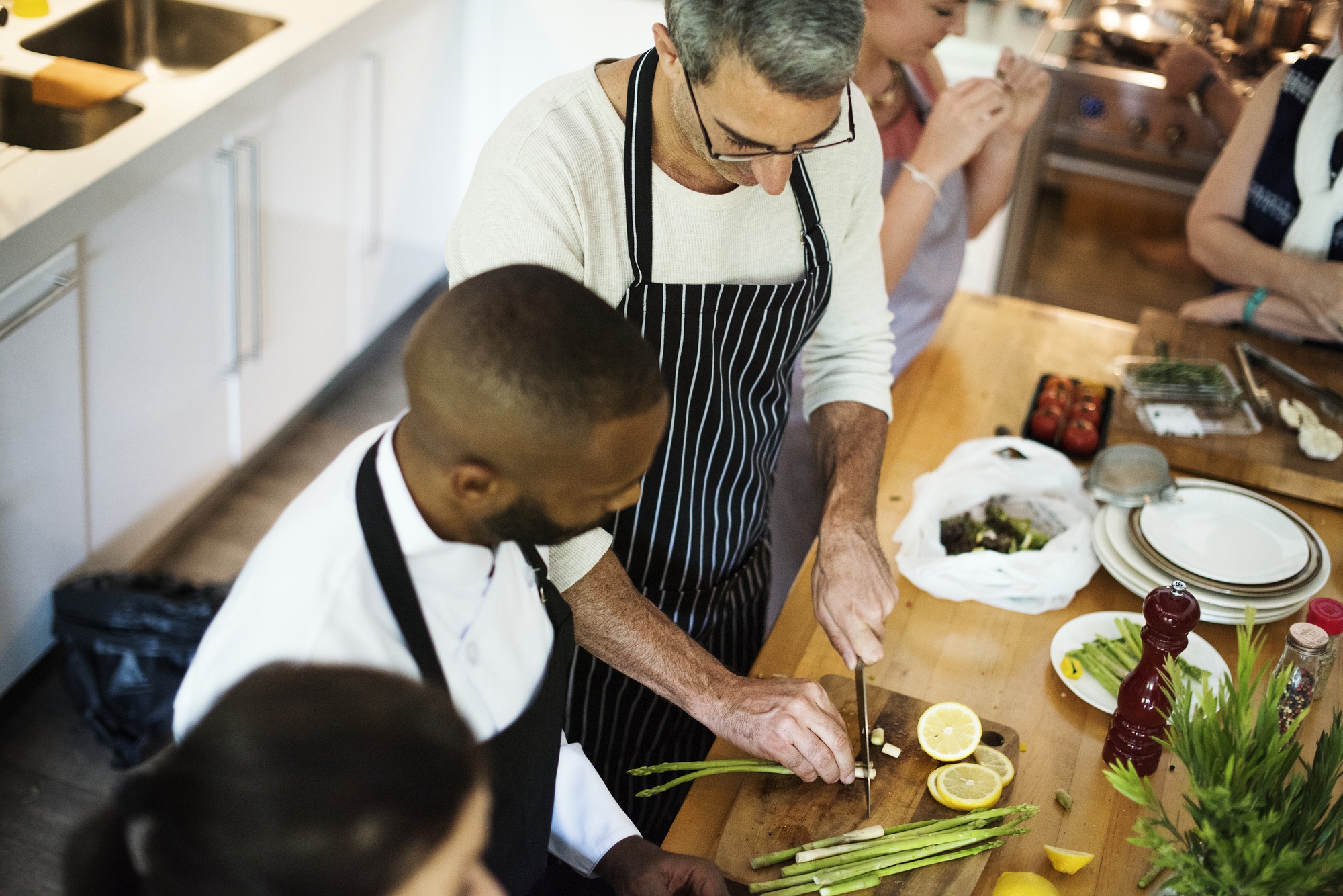Small artisan kitchen workshop with chefs collaborating