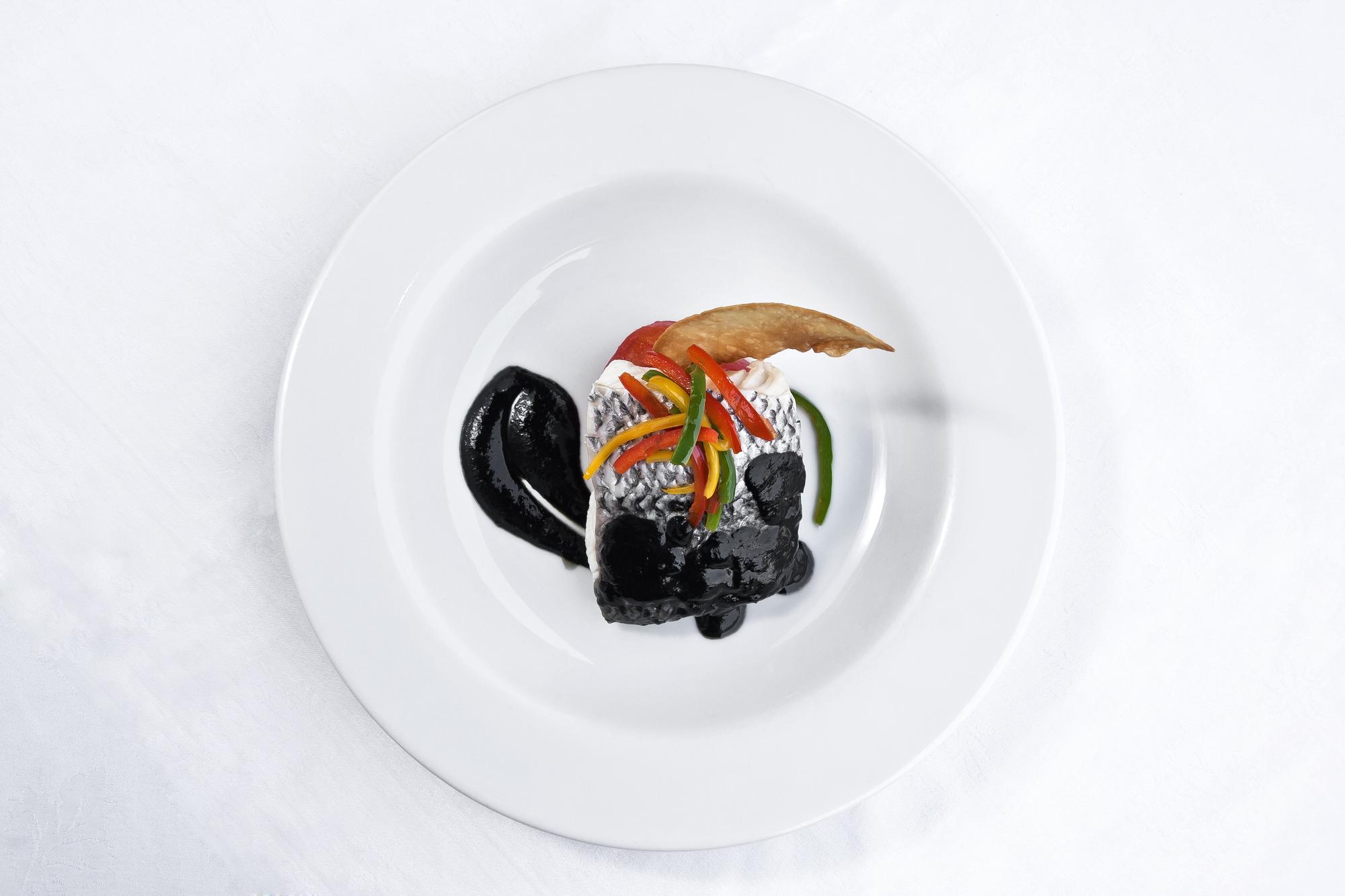 Large editorial photo of plated tasting menu